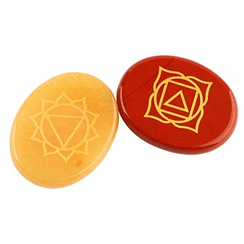 Två chakra-stenar med symboler.