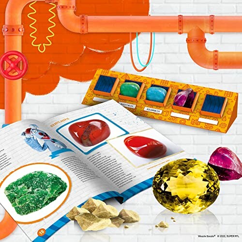 Uppslagsbok med ädelstenar och leksaksrör