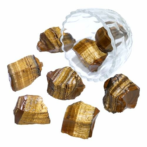 Tigerrandiga stenar i ett glas